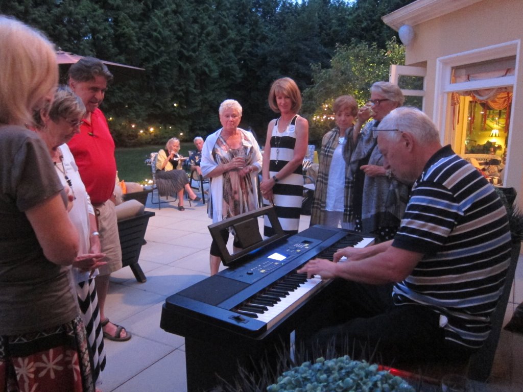 Bill Gibson playing music at the Class of 1965 the class picnic